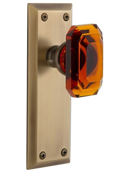 Grandeur Fifth-Avenue Door Set with Amber Crystal-Glass Baguette Knobs in Antique Brass.